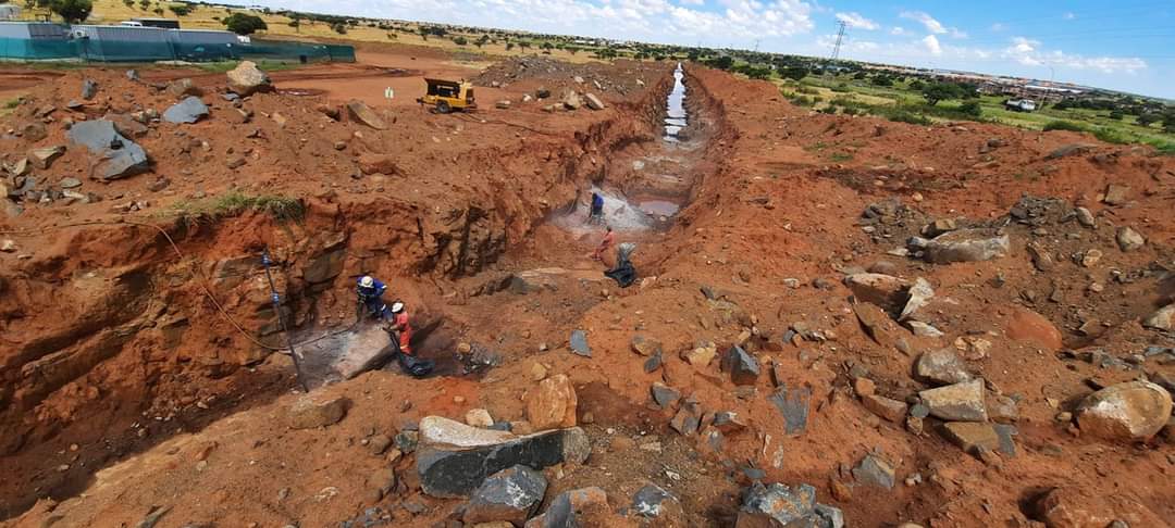 N&M trenching work across a rocky construction site